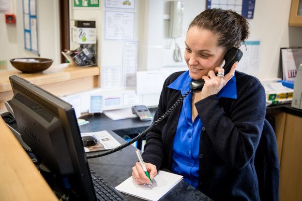 Image of a veterinary receptionist working