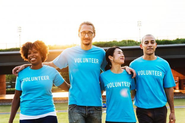 People wearing volunteering t shirts